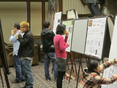 Everyone takes the opportunity to eat and drink as the second poster session beings